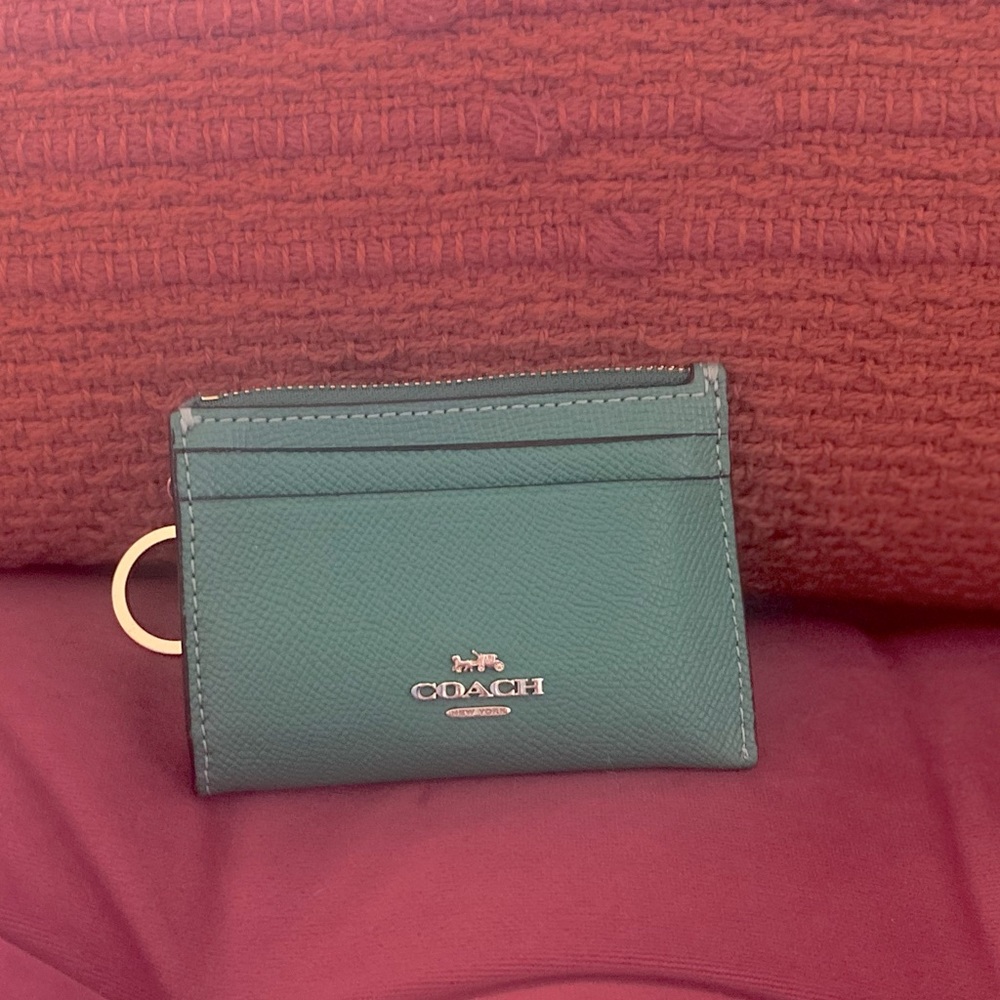 Coach card holder with key ring. Beautiful color, zipper broke, but is included